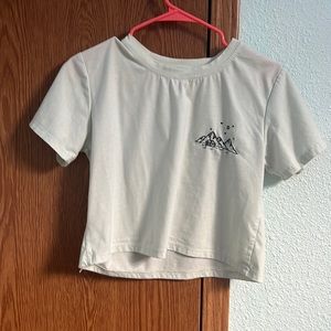 green crop top, embroidered on in black is mountains and a little cabin.